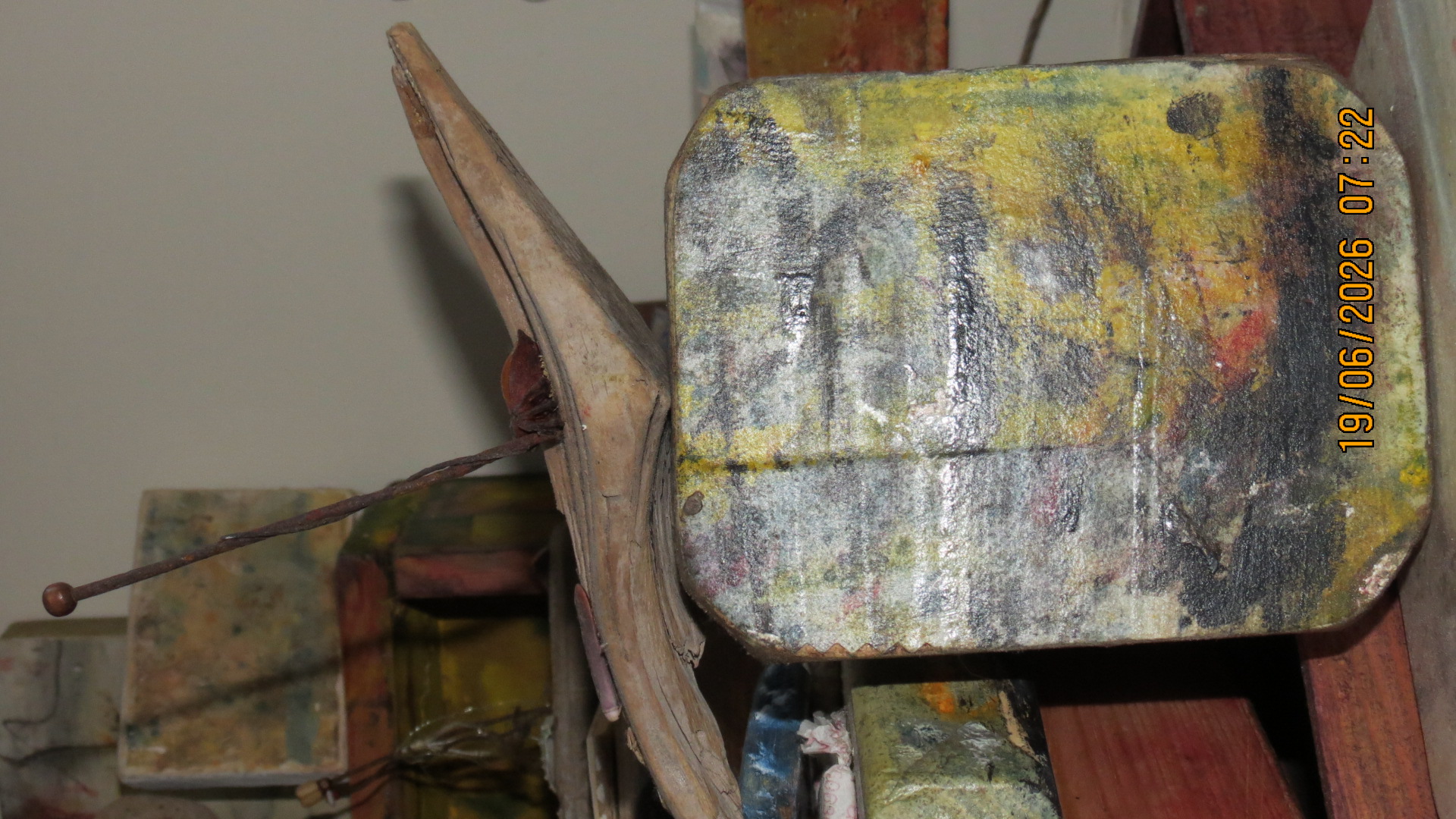 Found object sculpture — driftwood and wire close-up