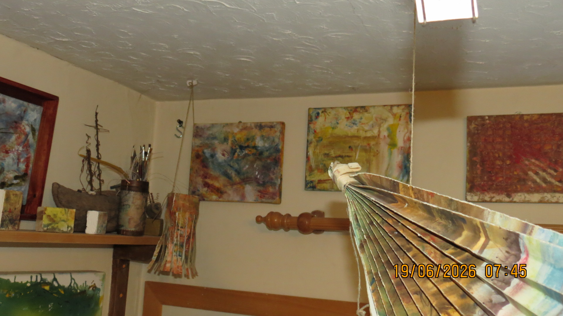 Studio — paintings displayed on the walls