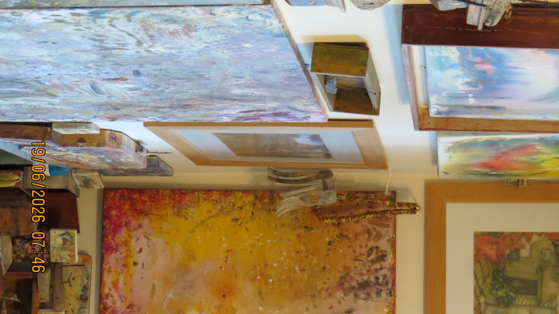 Studio — canvas and paintings in every direction